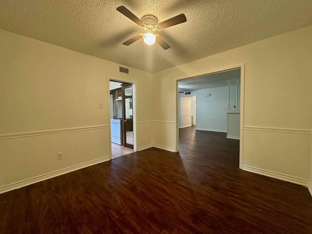 790 Pinchback Rd, Beaumont, TX 77707 - empty room with wood finished floors, ceiling fan, a textured ceiling, and baseboards