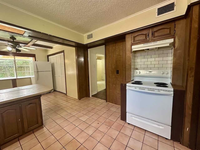 790 Pinchback Rd, Beaumont, TX 77707 - kitchen featuring white appliances, under cabinet range hood, a textured ceiling, a ceiling fan, and light countertops
