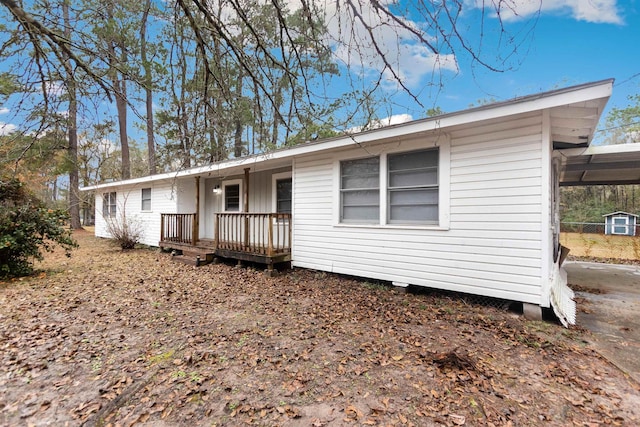 view of front of home featuring a carport