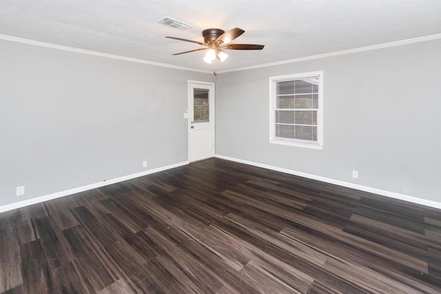 spare room featuring dark wood-type flooring, ceiling fan, and ornamental molding