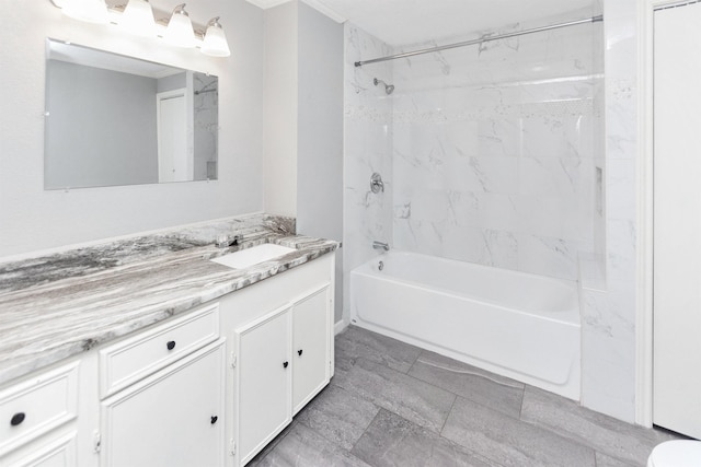 bathroom featuring vanity and tiled shower / bath combo