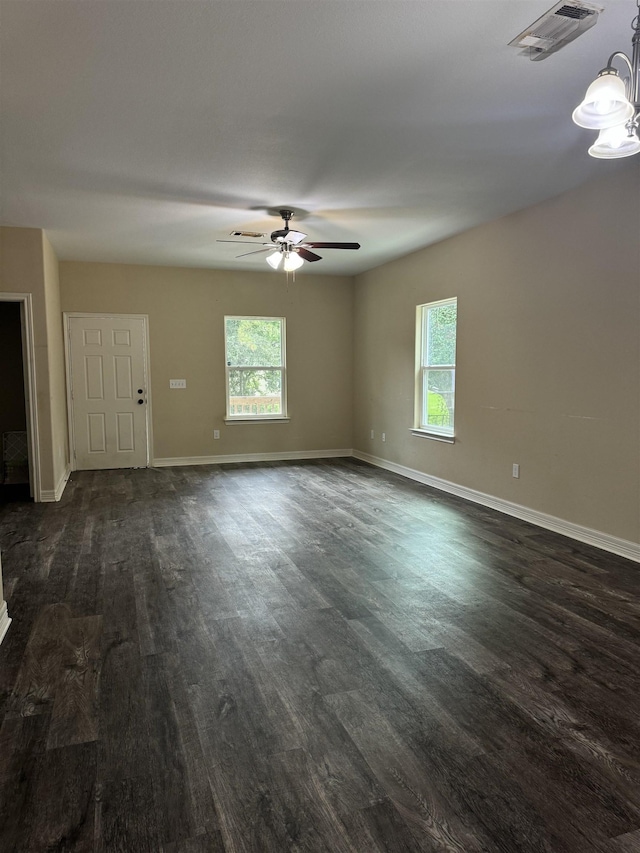 spare room featuring ceiling fan and dark hardwood / wood-style floors