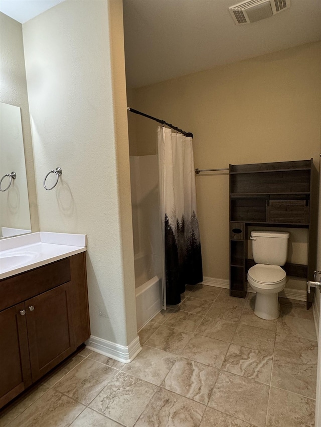 full bathroom featuring shower / tub combo, vanity, and toilet