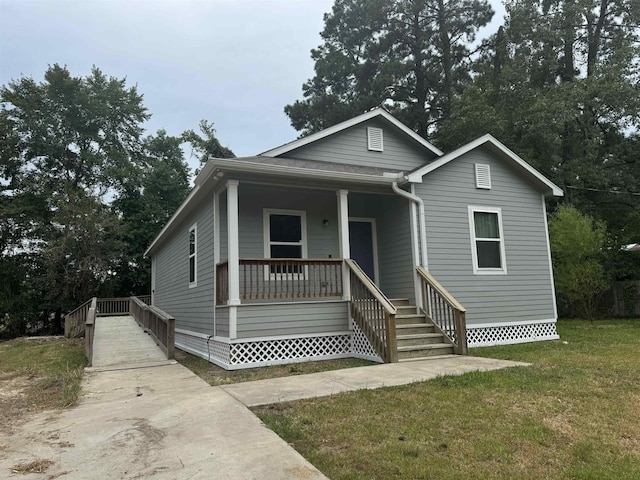 bungalow-style house with a porch and a front yard