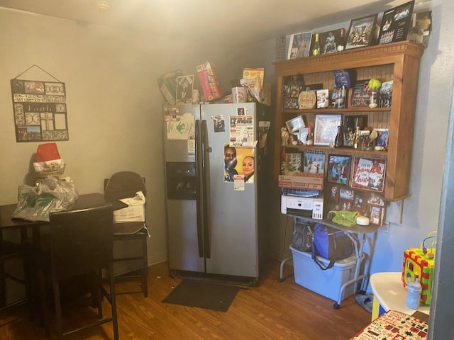 kitchen featuring stainless steel refrigerator with ice dispenser and hardwood / wood-style flooring