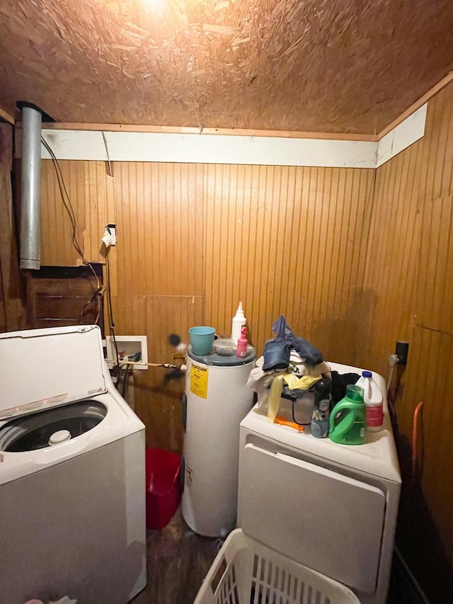 laundry room featuring washer and clothes dryer and water heater