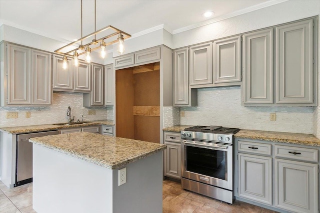 kitchen with gray cabinets, a kitchen island, sink, hanging light fixtures, and stainless steel appliances