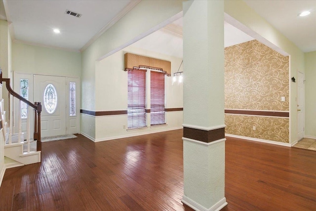 foyer entrance featuring hardwood / wood-style flooring and ornamental molding