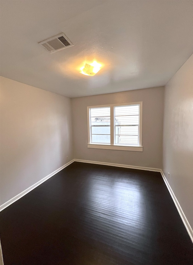 empty room featuring dark hardwood / wood-style floors