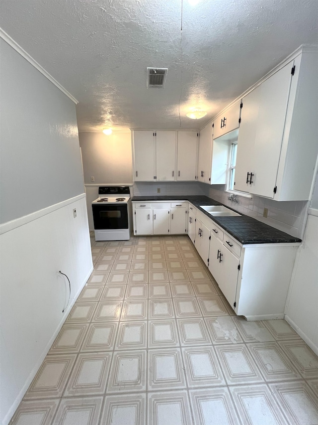 kitchen featuring backsplash, a textured ceiling, white range with electric stovetop, sink, and white cabinets