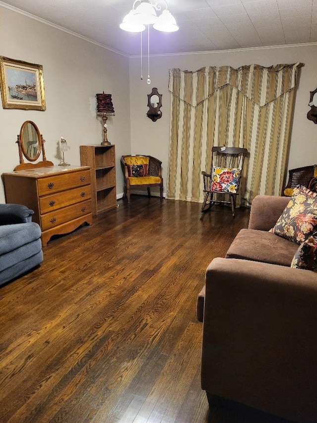 living room featuring dark hardwood / wood-style flooring and ornamental molding