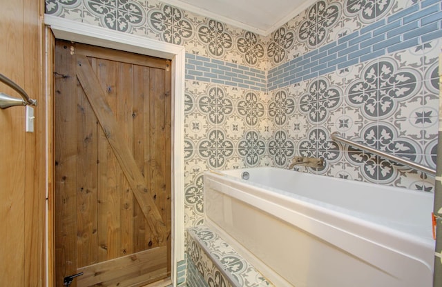 bathroom with a bathtub and ornamental molding