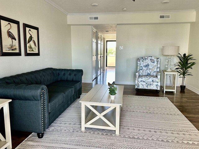 560 Pleasure Island Blvd, Port Arthur, TX 77640 - living area featuring wood finished floors, ornamental molding, and baseboards