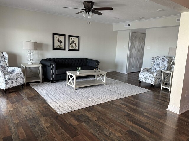 560 Pleasure Island Blvd, Port Arthur, TX 77640 - living area featuring a ceiling fan, crown molding, wood finished floors, and baseboards