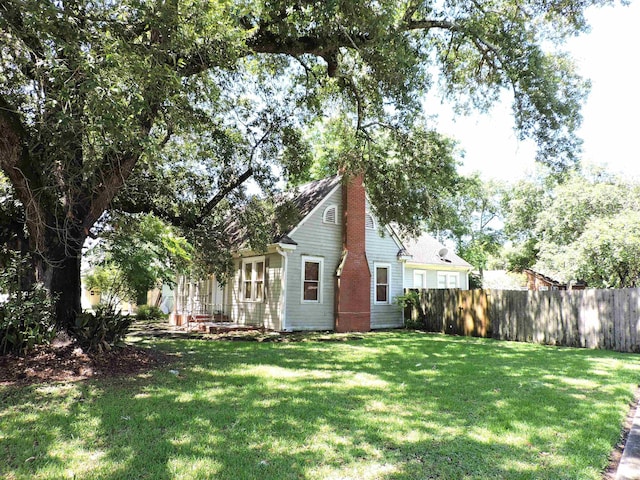 4545 Hollywood Dr, Port Arthur, TX 77642 - rear view of property with a chimney