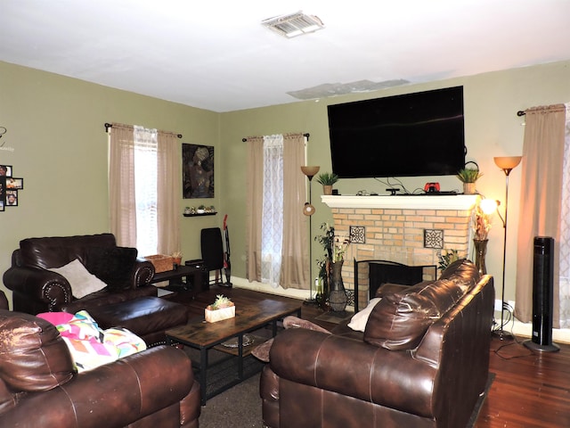 4545 Hollywood Dr, Port Arthur, TX 77642 - living room featuring wood finished floors, baseboards, and a fireplace