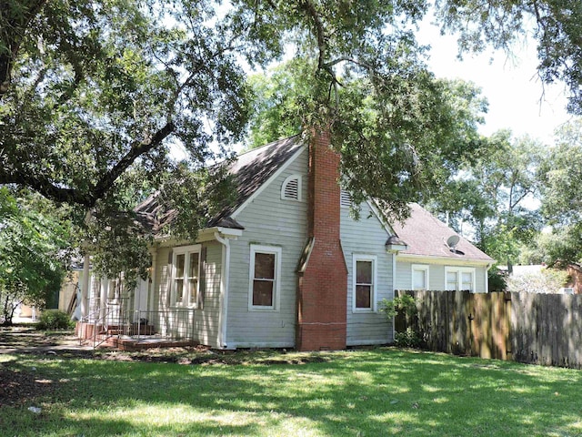 4545 Hollywood Dr, Port Arthur, TX 77642 - view of home's exterior featuring a chimney