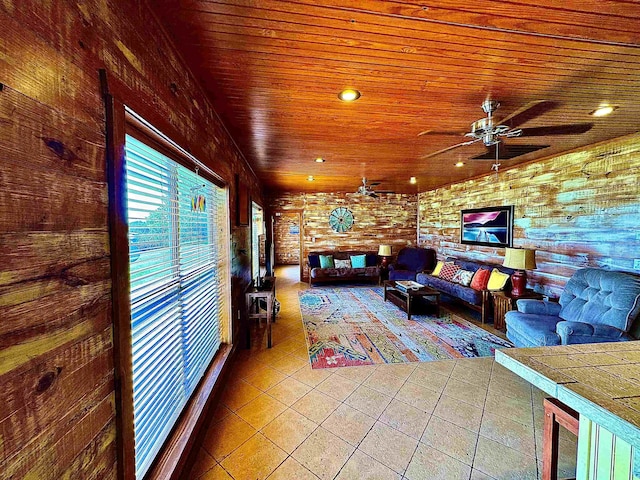 tiled living area with wood ceiling and a ceiling fan