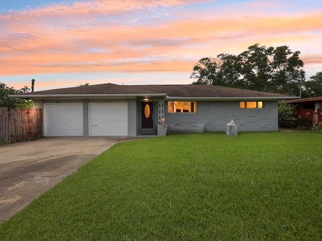 4015 42nd St, Port Arthur, TX 77642 - ranch-style home with a garage, concrete driveway, and brick siding