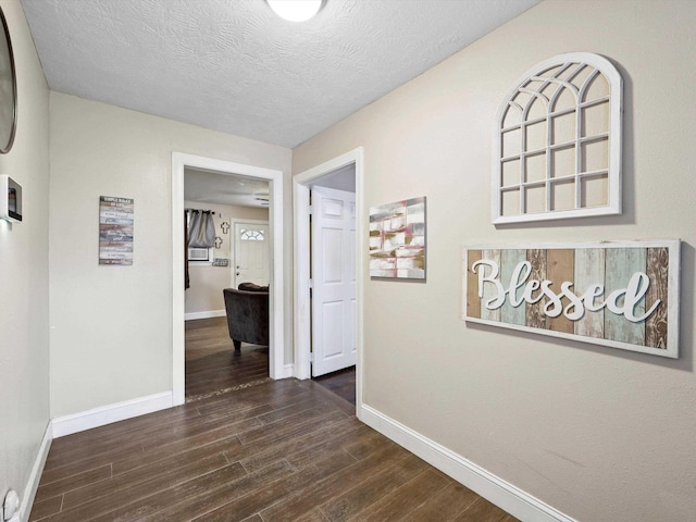 4015 42nd St, Port Arthur, TX 77642 - corridor featuring dark wood-style flooring and a textured ceiling