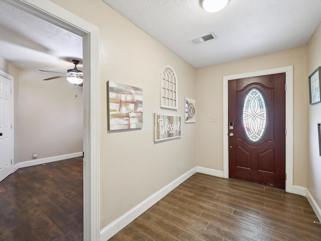 4015 42nd St, Port Arthur, TX 77642 - foyer entrance with wood finished floors, ceiling fan, and a textured ceiling