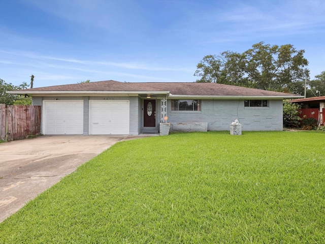 4015 42nd St, Port Arthur, TX 77642 - ranch-style house with an attached garage, driveway, and brick siding