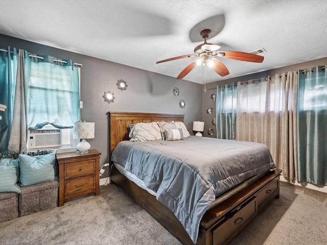 4015 42nd St, Port Arthur, TX 77642 - carpeted bedroom featuring cooling unit, ceiling fan, and a textured ceiling