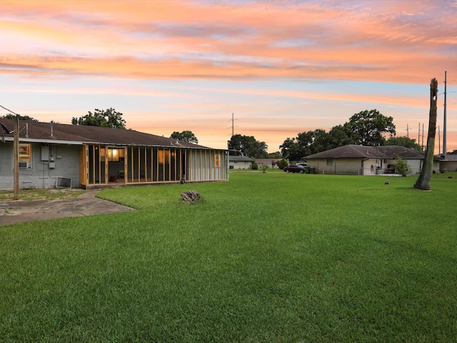 4015 42nd St, Port Arthur, TX 77642 - yard at dusk with a yard