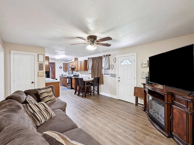 4015 42nd St, Port Arthur, TX 77642 - living area with a ceiling fan and light wood finished floors