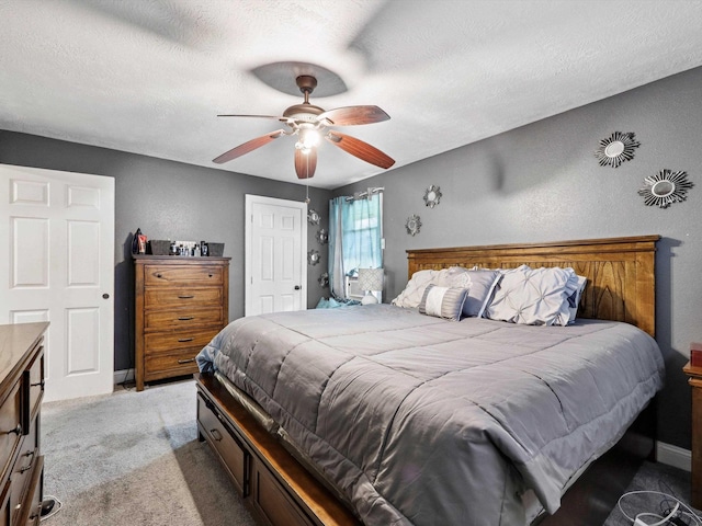 4015 42nd St, Port Arthur, TX 77642 - bedroom featuring light carpet, a ceiling fan, a textured ceiling, and a closet