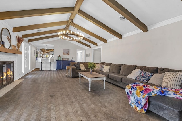 5855 Gladys Ave, Beaumont, TX 77706 - living area with a chandelier, a fireplace, and baseboards