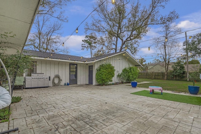 5855 Gladys Ave, Beaumont, TX 77706 - view of front of property with a patio and board and batten siding