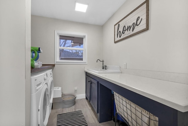 5855 Gladys Ave, Beaumont, TX 77706 - bathroom with washing machine and clothes dryer, toilet, vanity, and baseboards
