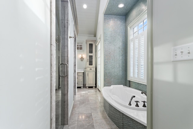 bathroom with tile patterned flooring and plus walk in shower