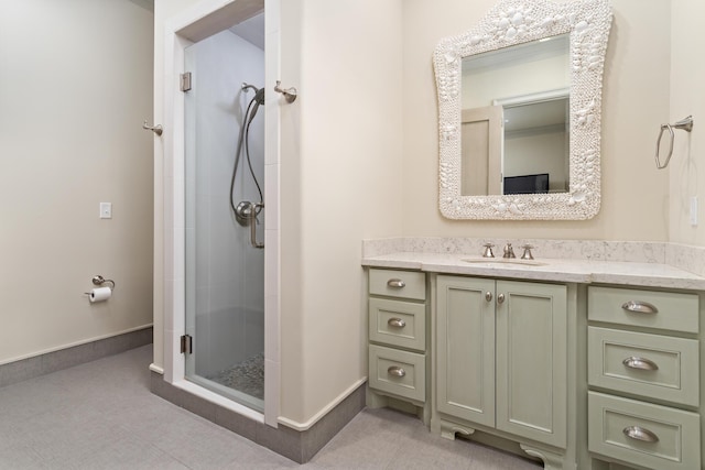 bathroom with vanity and a shower with door