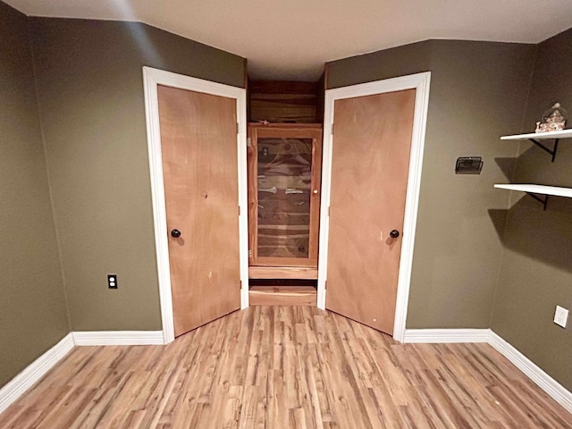 2522 Tucker Rd, Silsbee, TX 77656 - unfurnished bedroom with light wood-style floors and baseboards