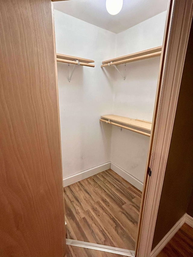 2522 Tucker Rd, Silsbee, TX 77656 - walk in closet featuring wood finished floors