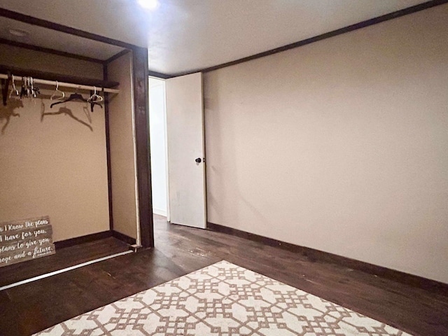 2522 Tucker Rd, Silsbee, TX 77656 - unfurnished bedroom featuring wood finished floors and baseboards
