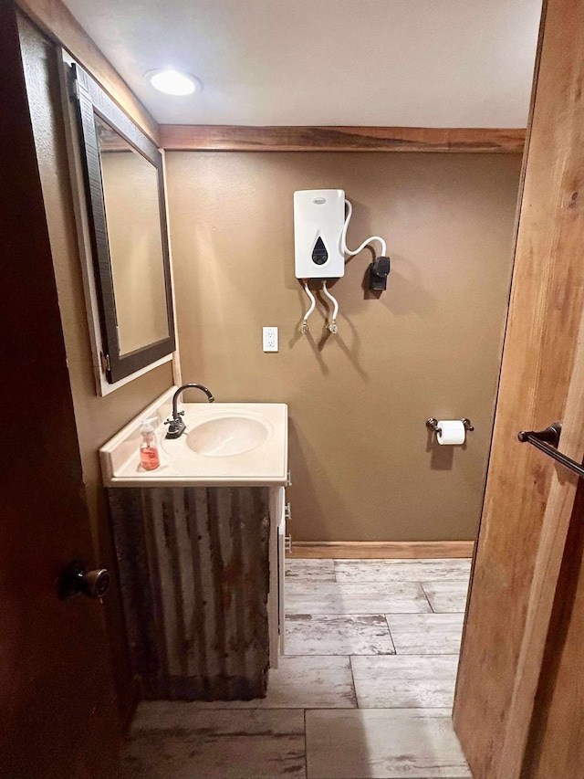 2522 Tucker Rd, Silsbee, TX 77656 - bathroom with vanity and wood finished floors