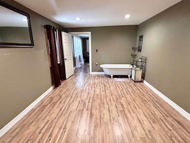 2522 Tucker Rd, Silsbee, TX 77656 - hallway featuring light wood-type flooring, baseboards, and recessed lighting