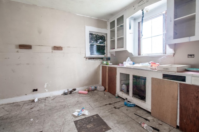 kitchen featuring white cabinets