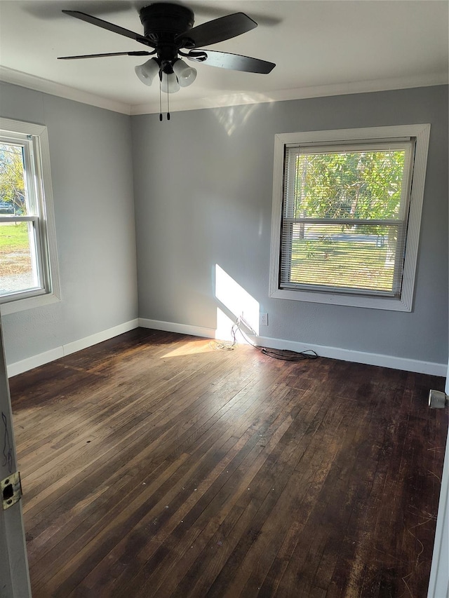 unfurnished room featuring crown molding, dark hardwood / wood-style flooring, and ceiling fan