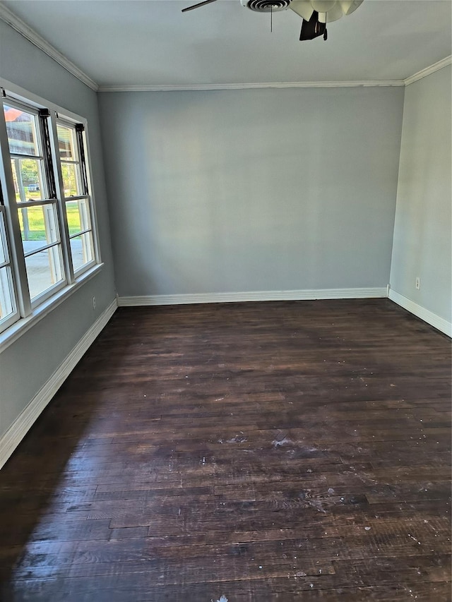 spare room featuring ceiling fan, dark hardwood / wood-style flooring, and ornamental molding