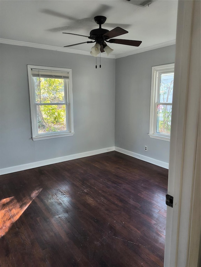 empty room featuring ceiling fan, dark hardwood / wood-style flooring, and ornamental molding