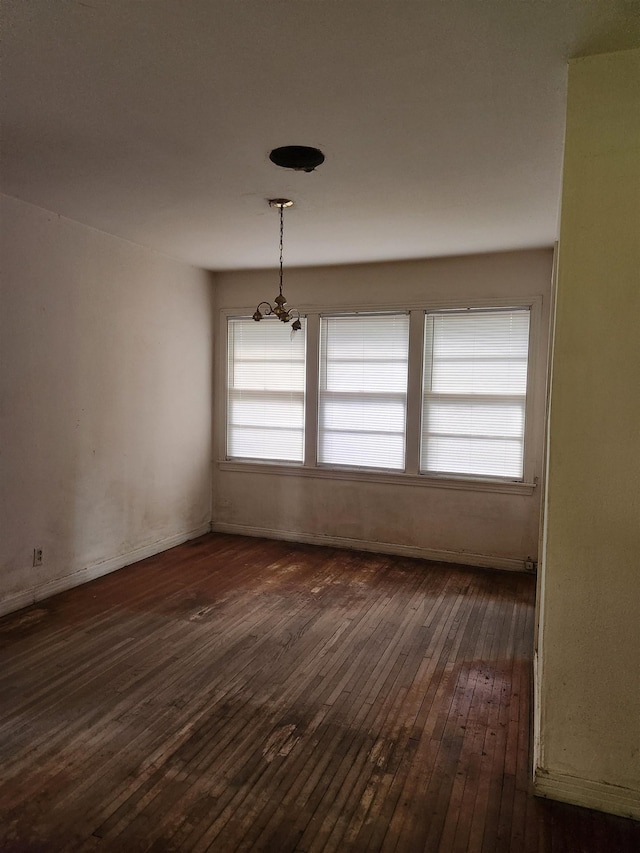 970 Peyton Dr, Beaumont, TX 77706 - spare room featuring a chandelier and dark wood finished floors