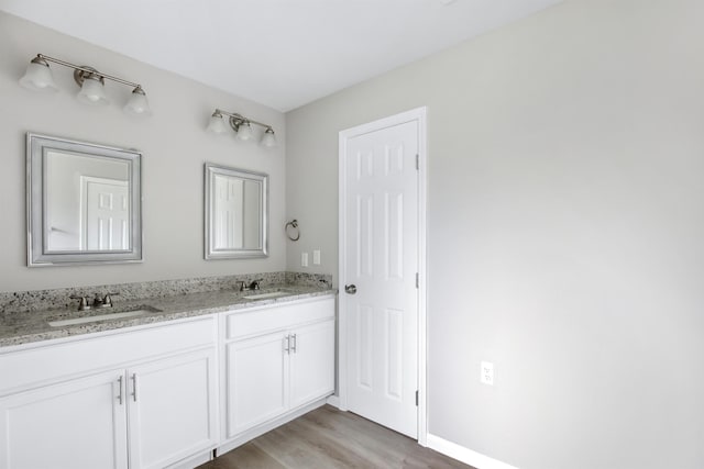 bathroom featuring hardwood / wood-style floors and vanity