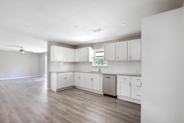 kitchen featuring decorative backsplash, stainless steel dishwasher, ceiling fan, light hardwood / wood-style flooring, and white cabinetry