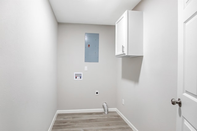 laundry area featuring cabinets, washer hookup, hookup for an electric dryer, light hardwood / wood-style floors, and electric panel