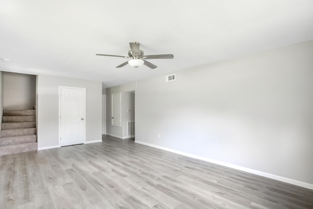 spare room featuring ceiling fan and light hardwood / wood-style floors