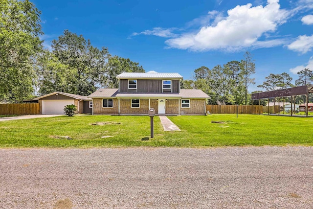 front facade with a garage and a front lawn